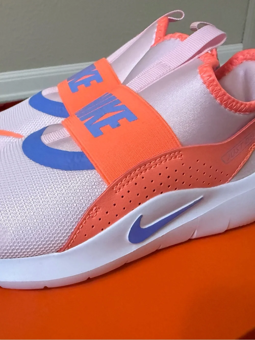 Nike Kids Slip-On Sneakers in white Orange & Purple Accents